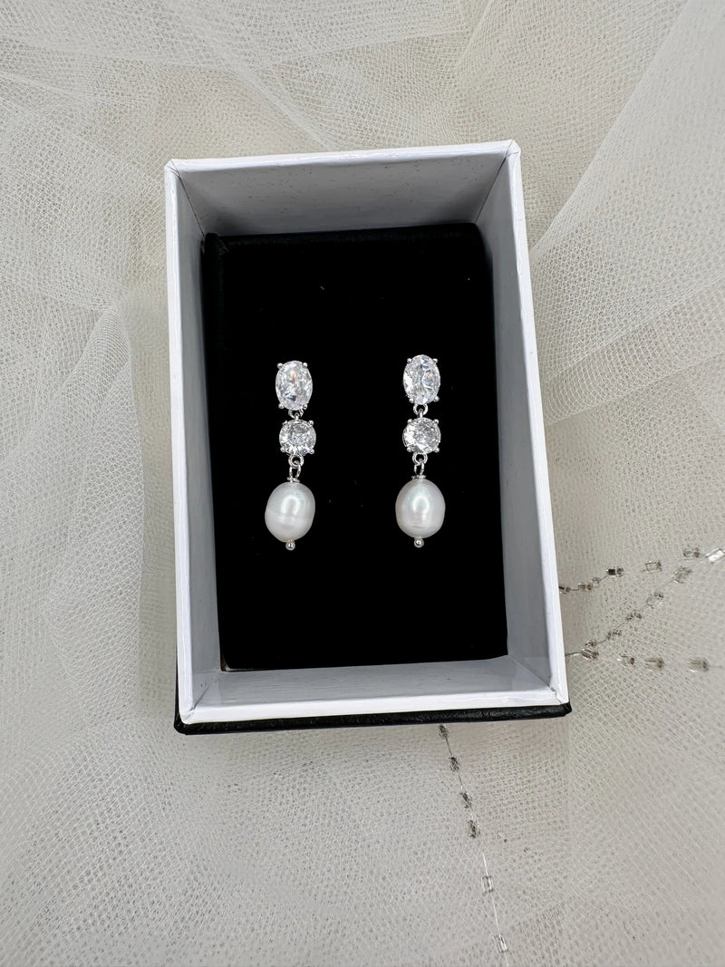Windsor Bridal Jewellery Pandora freshwater drop pearl earrings featuring elegant pearl drops and silver hooks, perfect for special occasions.