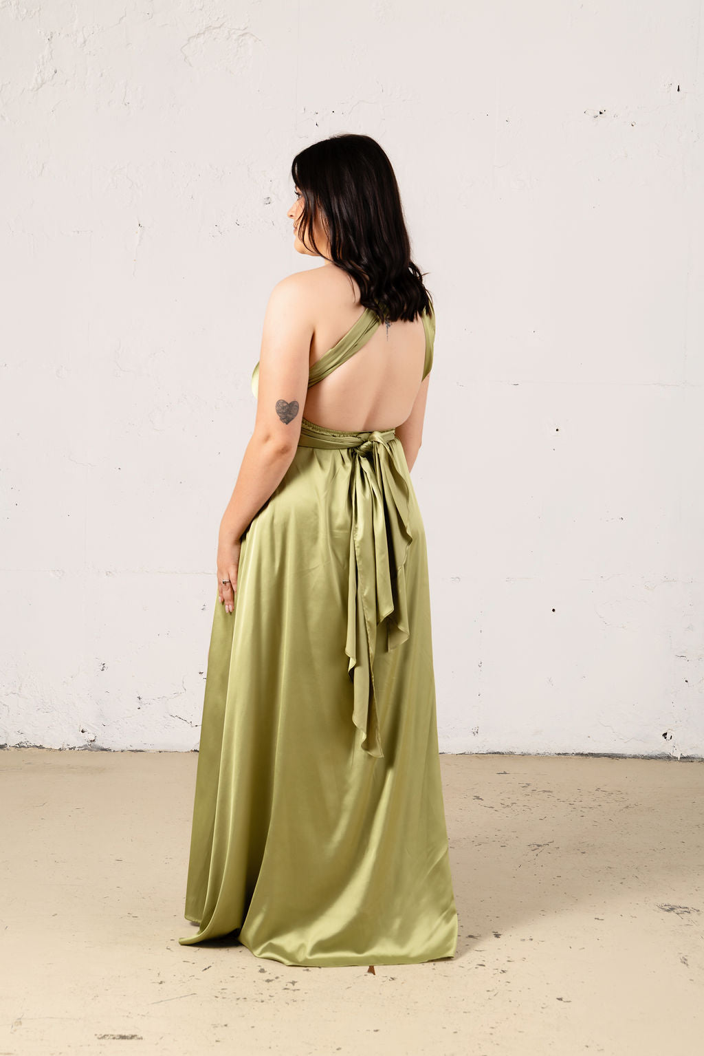 JOUNE satin multiway dress in elegant style, featuring smooth fabric and versatile design for various looks.