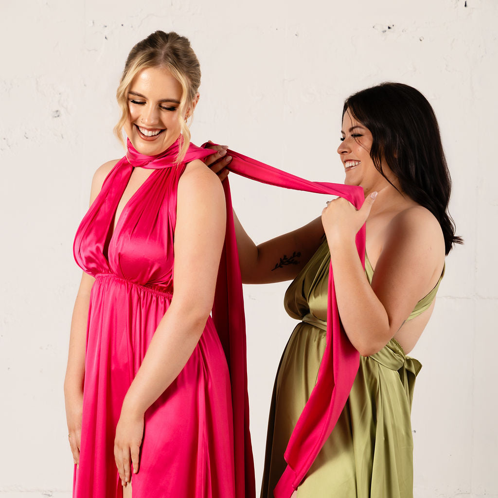 Elegant satin multiway dress by JOUNE, shown in a stylish group shot, highlighting its versatile design and smooth fabric.