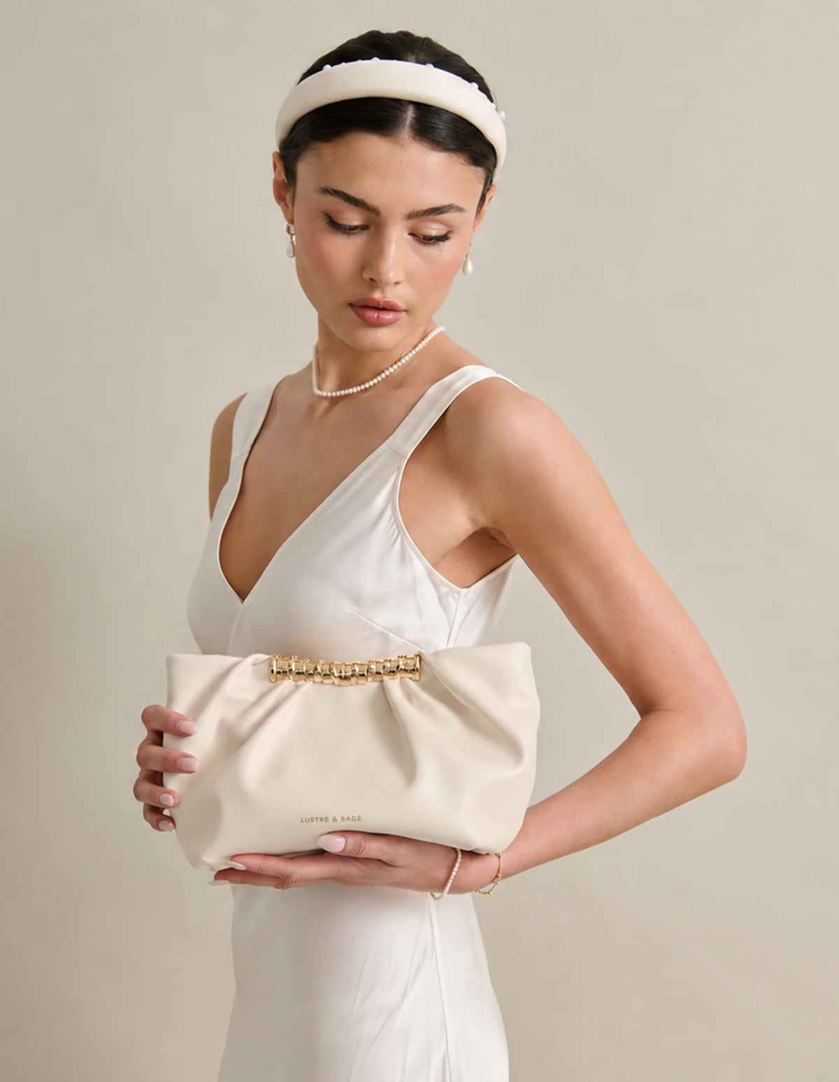 Aura Gathered Clutch Bag in Cream