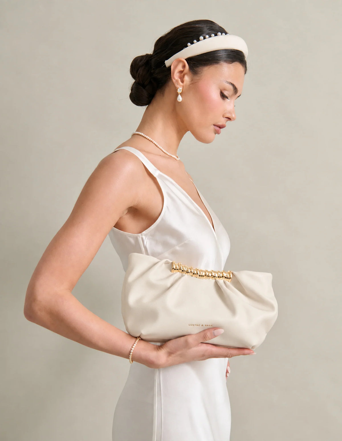 Aura Gathered Clutch Bag in Cream