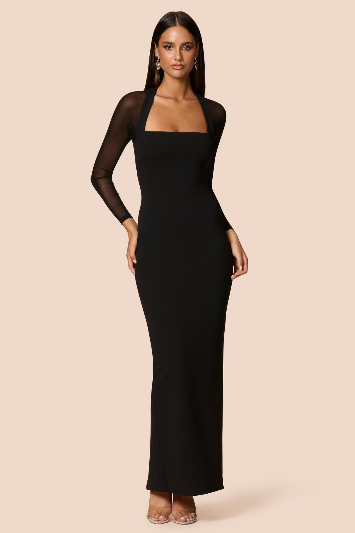 Nookie Amore Mesh Maxi Dress in black, featuring a flowing design and sheer mesh fabric, shown on a model.