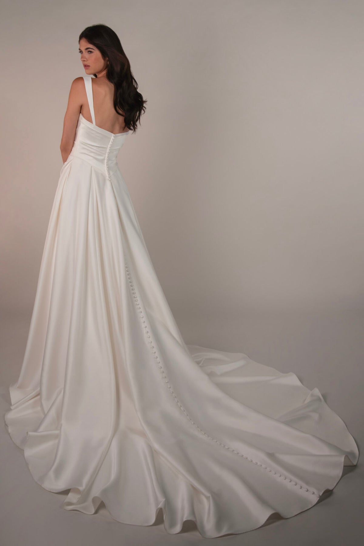 Stella York wedding gown Marion with lace details and flowy train, arriving November, elegant bridal dress on display.