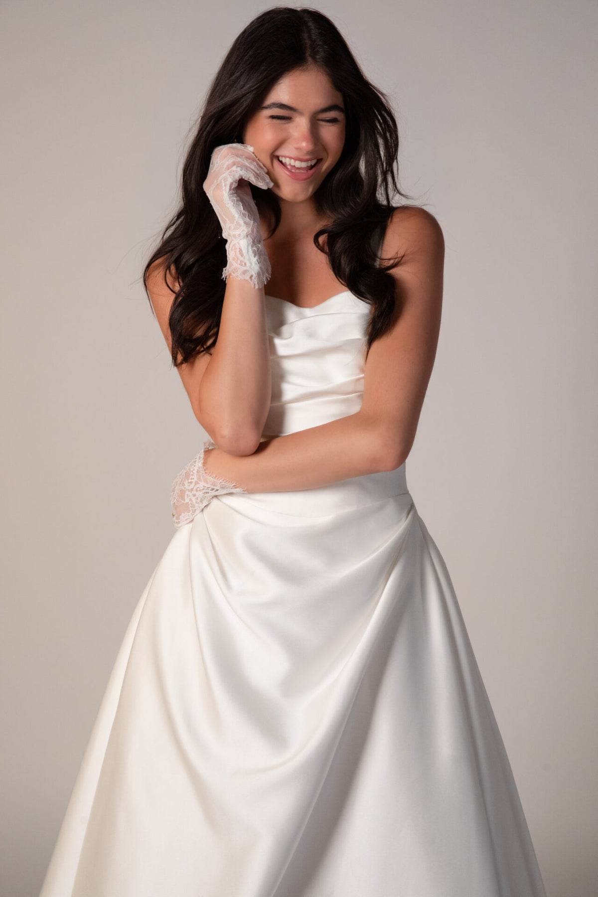 Stella York Marion wedding gown with lace details, fitted silhouette, and elegant train, displayed on a mannequin.