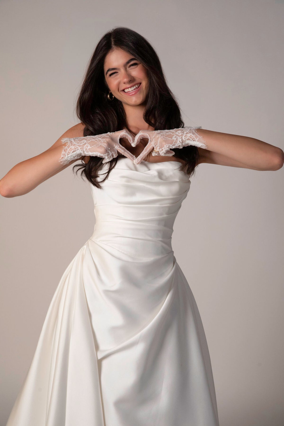 Stella York Marion wedding gown with lace details and elegant train, arriving in November, photographed on a mannequin.