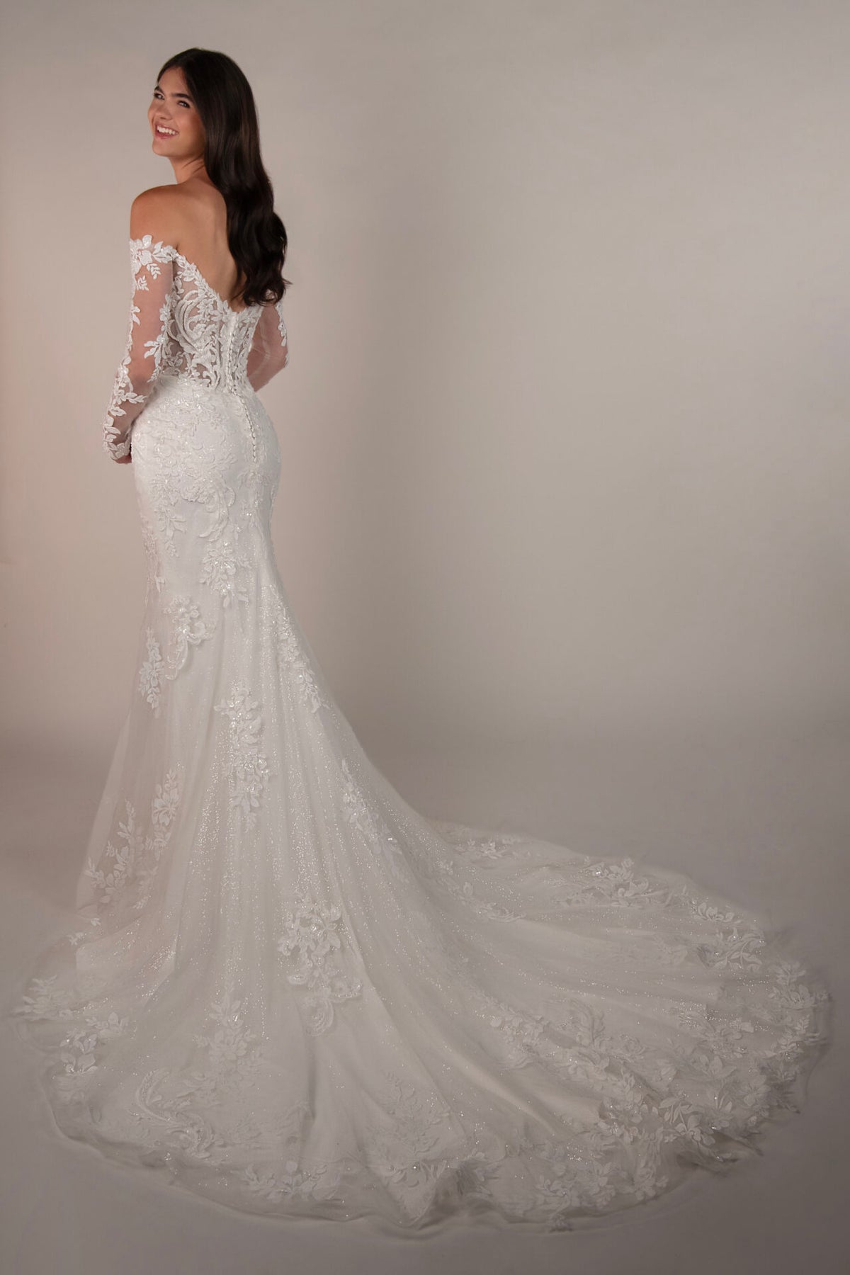 Stella York wedding gown by Mckinley, elegant lace design with a fitted silhouette, shown in a detailed front view.