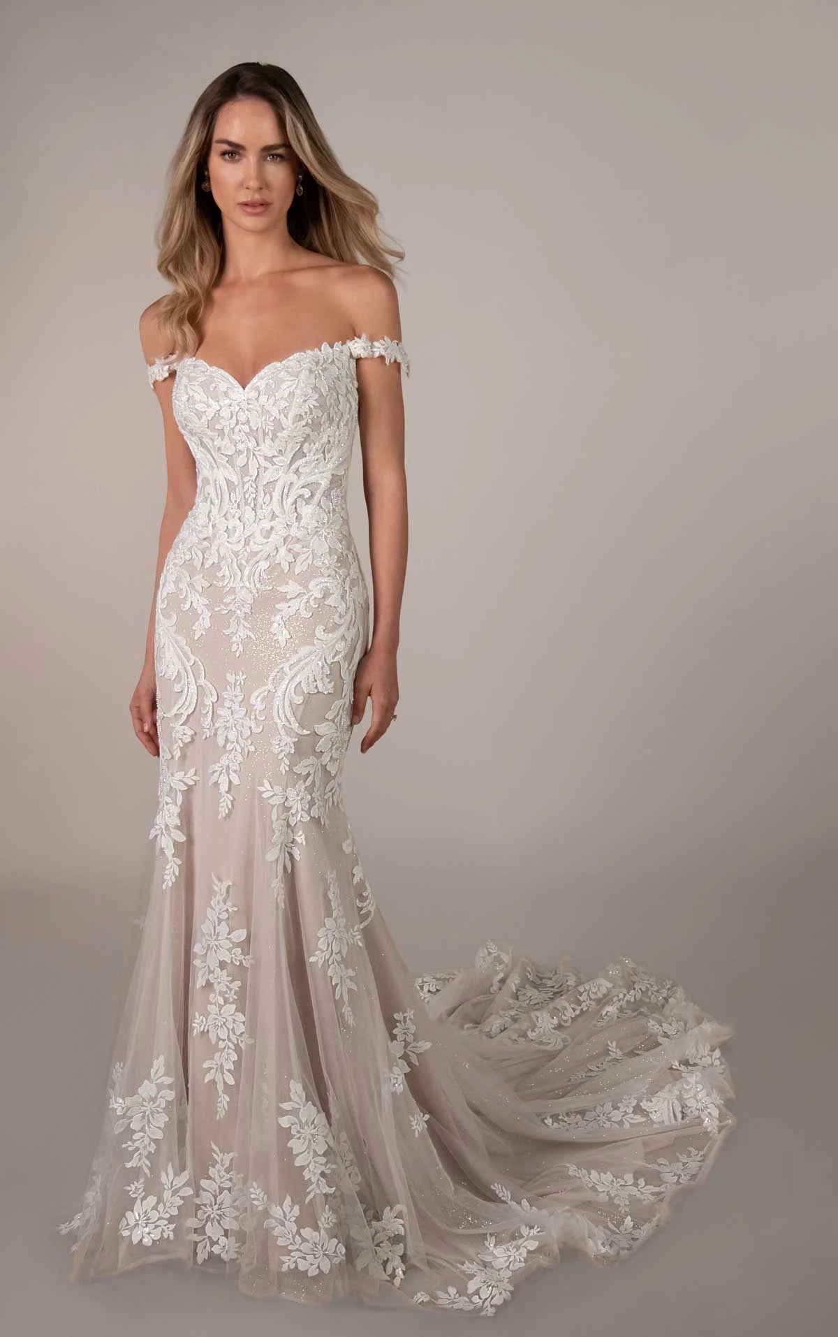 Stella York wedding gown SY8390 with lace and tulle, elegant A-line silhouette, displayed on a mannequin.