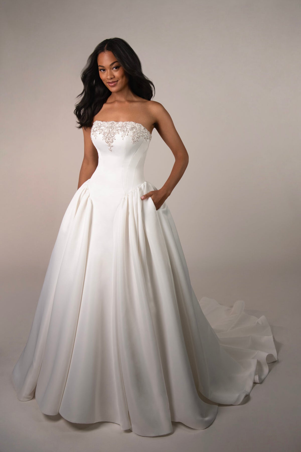 Stella York Mawson wedding gown on a hanger, featuring intricate lace details and a flowing train, designed for bridal elegance.