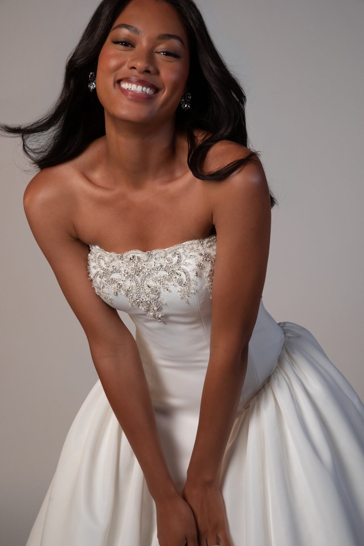 Stella York Mawson wedding gown with lace details and flowing train, shown in a full-length view on a model.