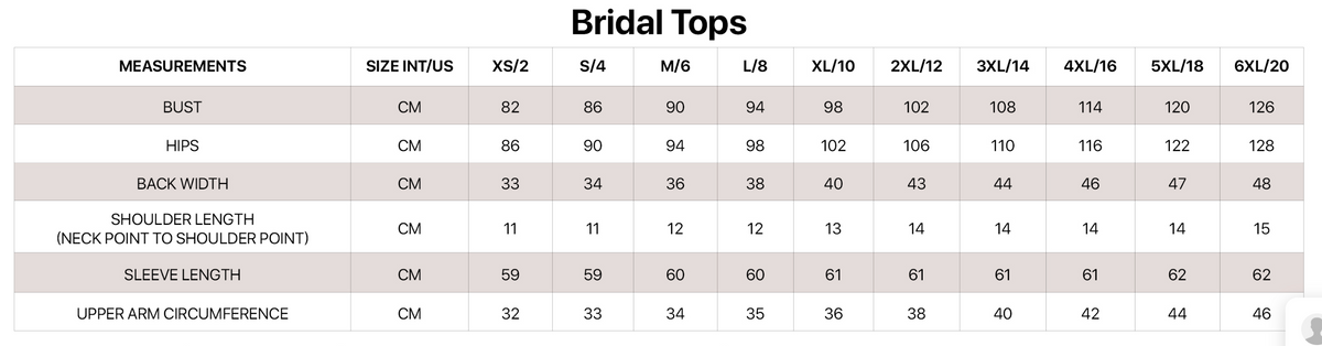 Bridal knit crop cardigan by Bianco Evento, soft white accessory with delicate texture, perfect for wedding or special occasion attire.