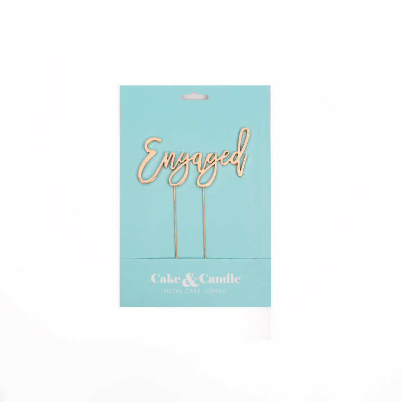 Gold "Engaged" cake topper from Cake and Candle giftware, featuring elegant script design for special celebrations.