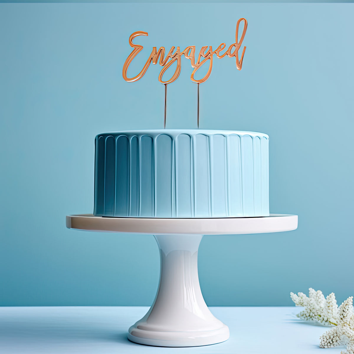 Gold "Engaged" Cake Topper from Cake and Candle, decorative giftware for engagement celebrations.