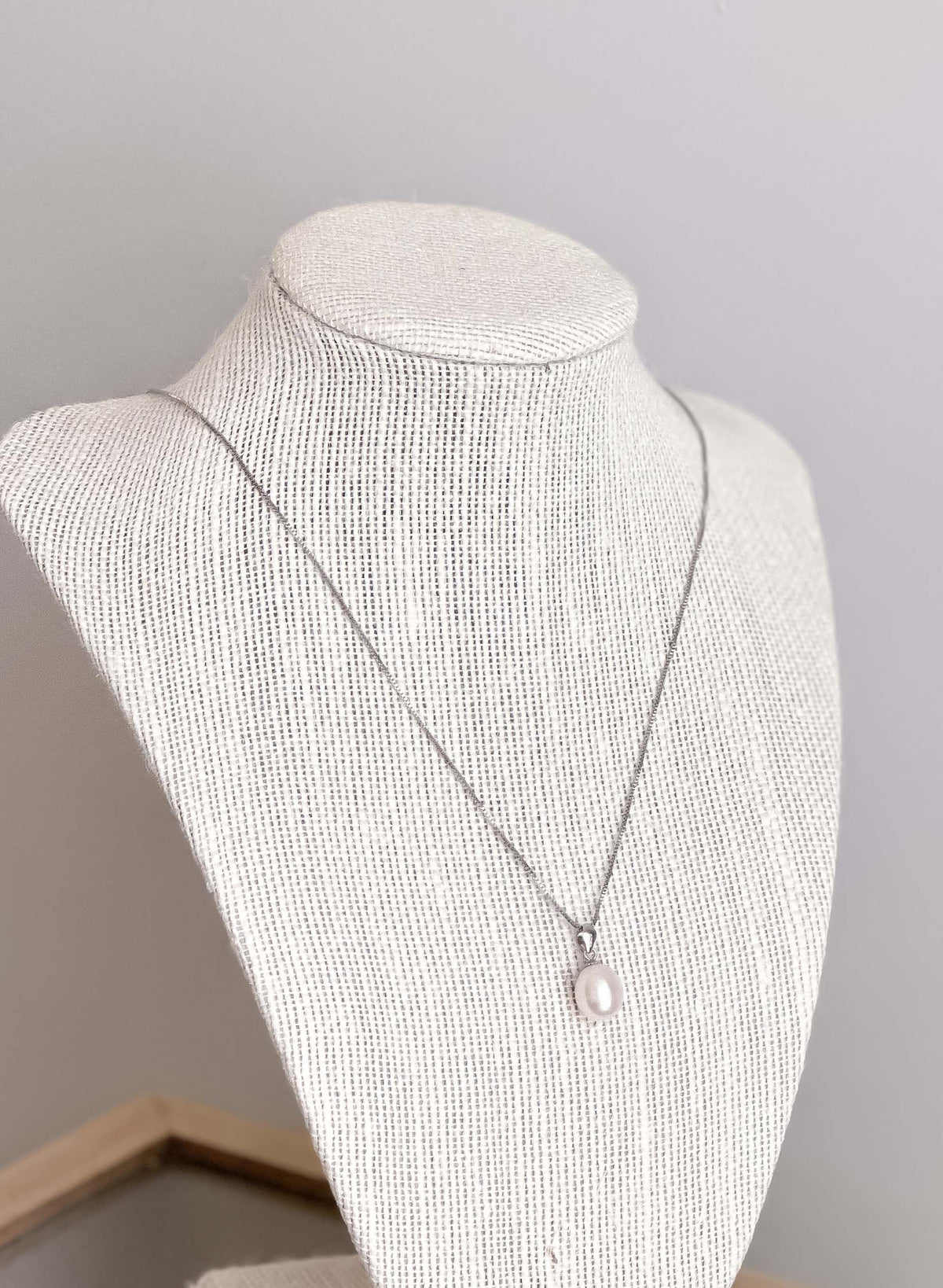 Julia freshwater pearl necklace by Wild Laurel featuring sterling silver chain and elegant pearl pendant.